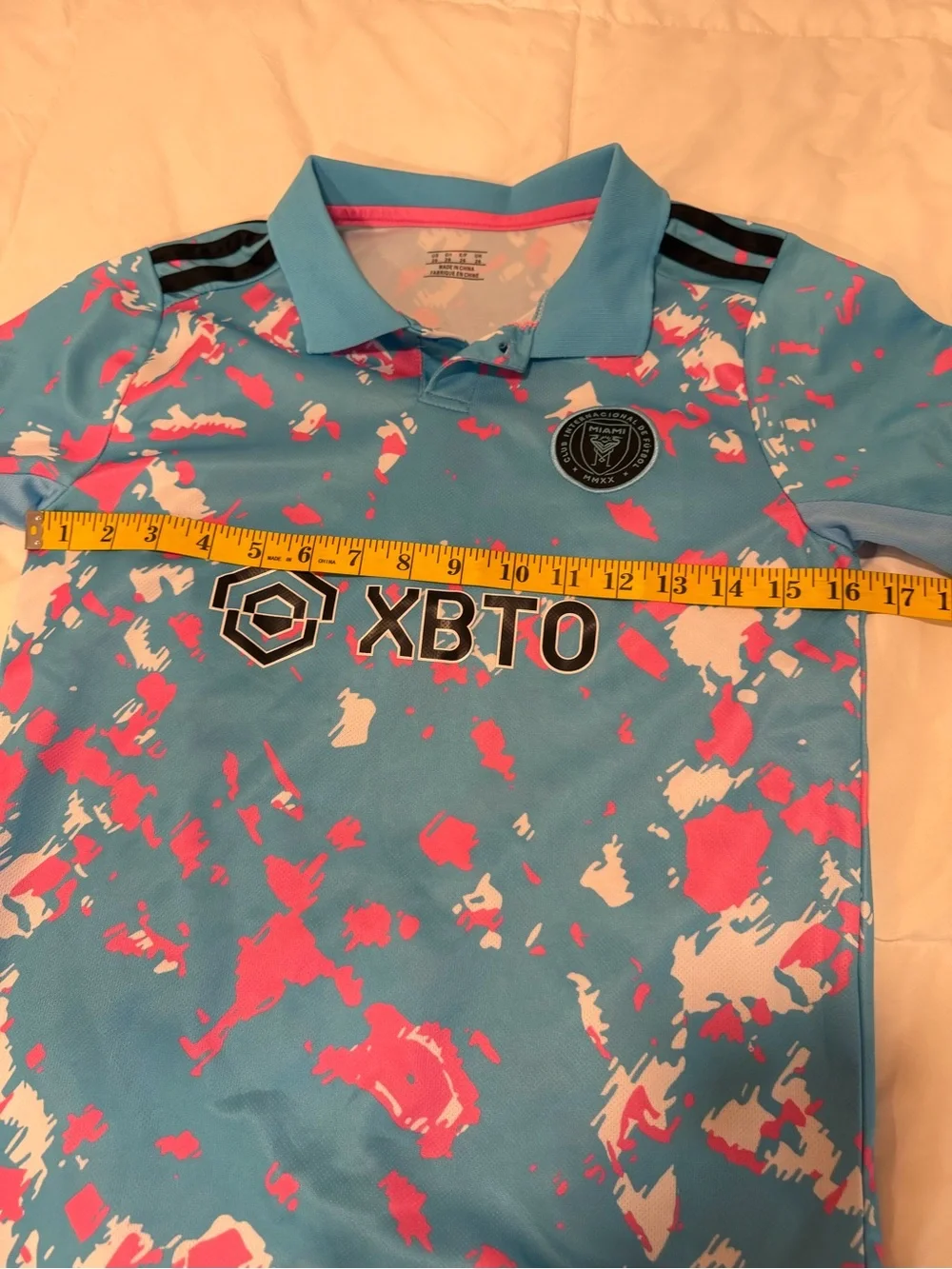 Kids' Aqua Polo with Pink & White Splash Print, team copy Messi size Large